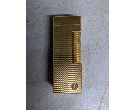 A Dunhill gold plated cigarette lighter Location: 