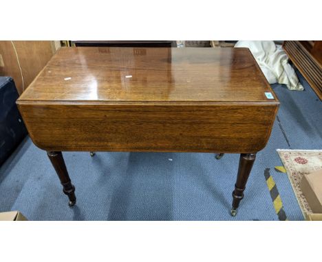 A 19th century mahogany gateleg table having single drawer and turned legs, together with an early Victorian mahogany wheel b