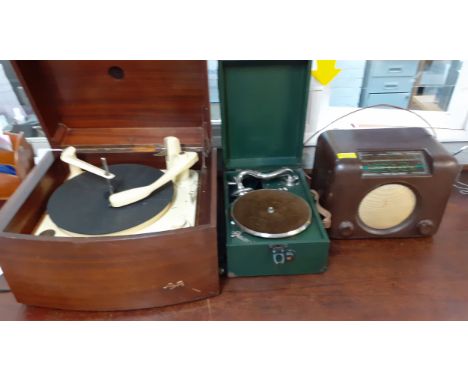 A vintage Pye record player, a vintage Bush radio, a green cased gramophone and 4 cases of vintage gramophone records. Locati