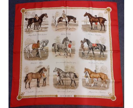 Hermes-A silk 'Les Robes' scarf designed by Ledoux having a deep red border surrounding images of 9 horses and riders having 