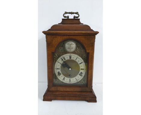 A mid 20th century Tempus Fugit 8 day walnut mantle clock having a Swiss lever escapement and striking on five gongs, 42cm hi