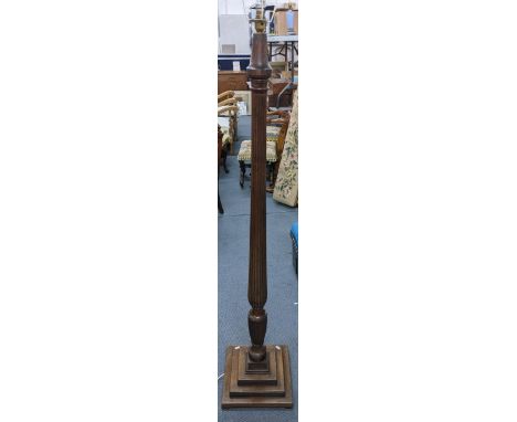 A Victorian mahogany 'bedpost' standard lamp having a reeded column and a stepped baseLocation: 
