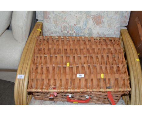 A wicker picnic hamper and contents 