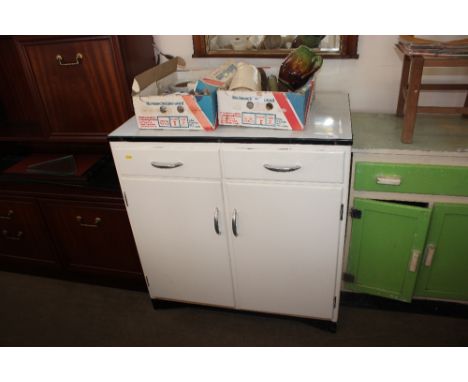 An enamel top kitchen cabinet fitted two drawers