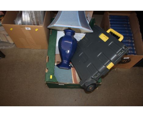 A box containing a blue lamp; various books etc 
