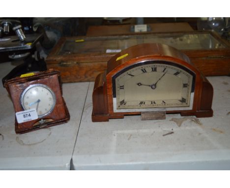 An eight day travelling clock together with a mahogany cased mantle clock with presentation plaque 