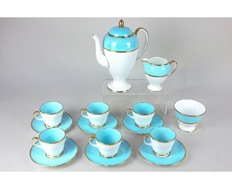 A Wedgwood porcelain coffee set for six in blue and white with gilt borders, comprising coffee pot, milk jug, sugar bowl and 