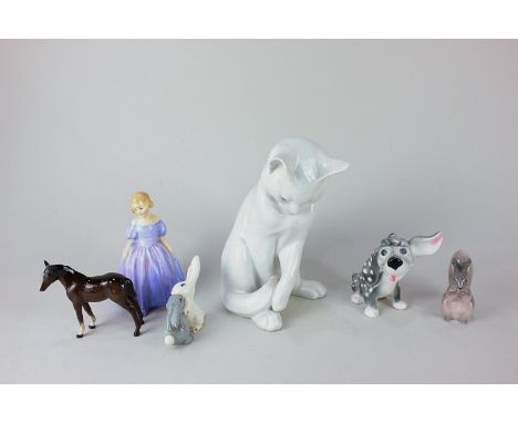 A Royal Copenhagen porcelain model of a white cat 340, 18cm high, a Royal Copenhagen porcelain model of a squirrel, a Goebel 