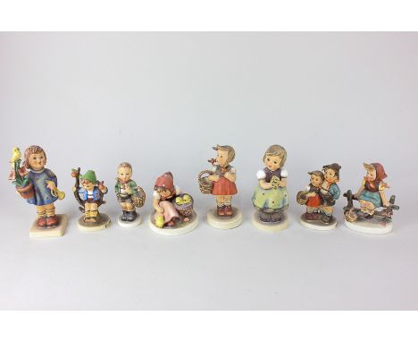 Eight Goebel porcelain Hummel figures of children, including 'For Mother', 'Surprise', 'Congratulations', and 'Apple' (a/f)