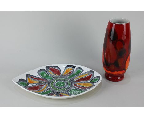 A Poole Pottery Delphis vase in orange and red, and an oval dish with orange, red and green design