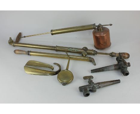 A collection of brassware to include a brass spray syringe 'The Everest' with turned wood handle, and a copper and brass pres