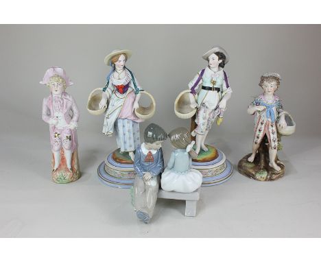 A Nao porcelain figure group of a boy and girl seated on a bench, a Rudolstadt Volkstedt porcelain figure of a boy (a/f), a p