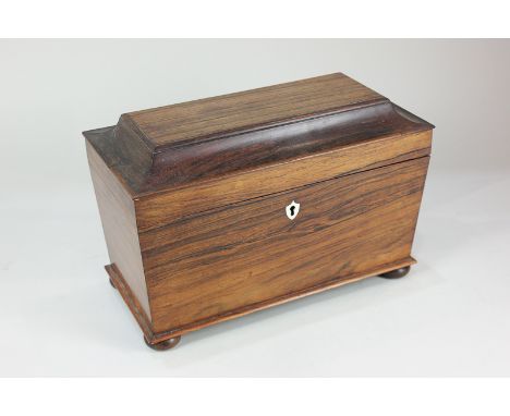A George III rosewood tea caddy with bone escutcheon, the interior with two zinc lined canisters, 33.5cm