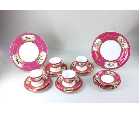 A Victorian porcelain part tea service with hand painted panels of birds, with pink border with gilt embellishments, marked S