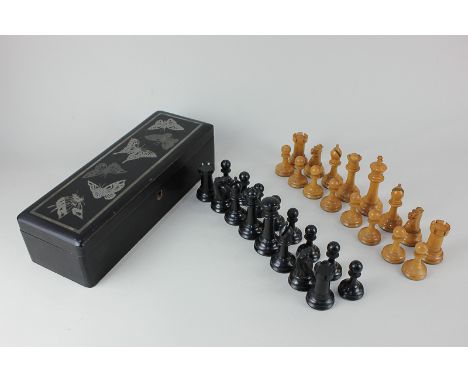 A wooden chess set, king 9.5cm, together with a rectangular lacquered box, metal inset with butterflies, 30.5cm, (a/f)