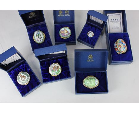A collection of seven Halcyon Days enamel trinket pots to include cats and birds, boxed