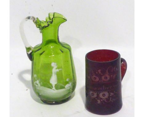A VICTORIAN MARY GREGORY GREEN AND WHITE GLASS JUG AND A VICTORIAN RUBY STAINED GLASS MUG (2) 