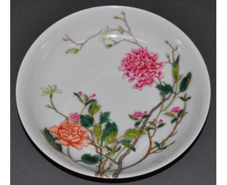 A Chinese famille rose shallow dish decorated with blossoming flowers and off shoot buds. bearing a Qianlong stlye seal mark 