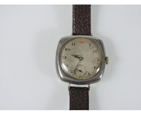 A silver cushion shaped wristwatch, the unsigned dial with Arabic numerals and subsidiary dial at 6 for constant seconds, fit