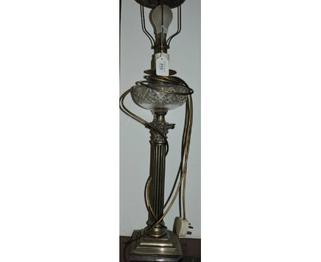 A 19th century brass oil lamp later converted to electricity, with corinthiam column base.