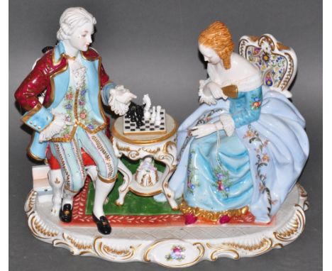 A 20th century German porcelain figure group, lady and gallant playing chess, H. 35cm. 