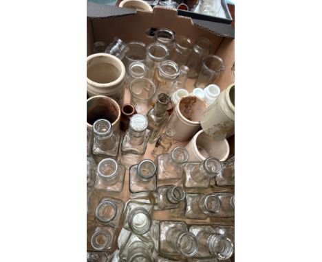 Large mixed lot of vintage glass bottles and stoneware jars, various shapes and sizes. Some with residue.