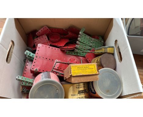 Vintage Meccano construction set includes assorted metal parts, boxed No.1 clockwork motor, and tin storage containers.