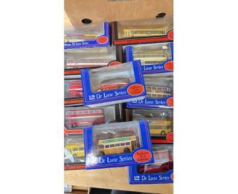Collection of 1:76 scale diecast model buses, "Exclusive First Editions" De Luxe Series. Includes various liveries and design