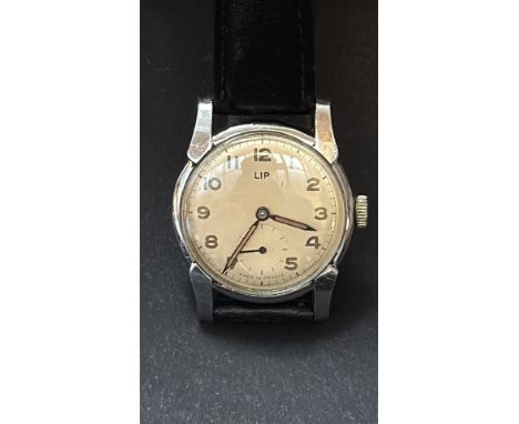 Vintage LIP wristwatch, from the mid-20th century. Features a mechanical movement, silver-tone case, and dial with sub-second