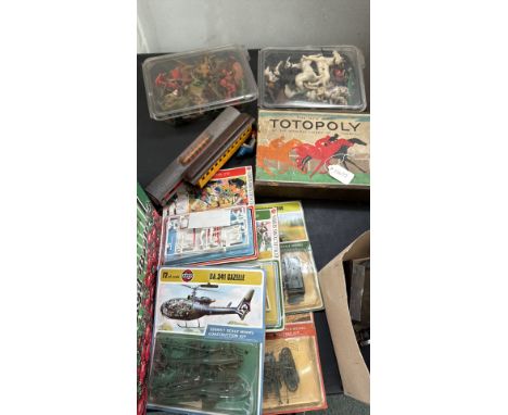 Vintage mixed lot includes Totopoly board game, plastic toy soldiers and animals, model kits by Airfix, and railway carriages
