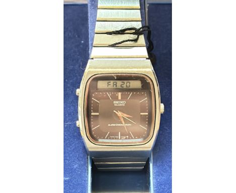 Vintage Seiko Quartz Alarm-Chronograph wristwatch, stainless steel case and bracelet, brown dial with dual-display functional