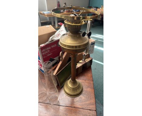 Vintage woodworking tools and miscellaneous collectibles, including wooden hand planes, a brass lamp base, glass chimney shad