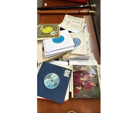 Large collection of vintage 7-inch vinyl records, featuring classic rock and pop artists, includes original sleeves and iconi