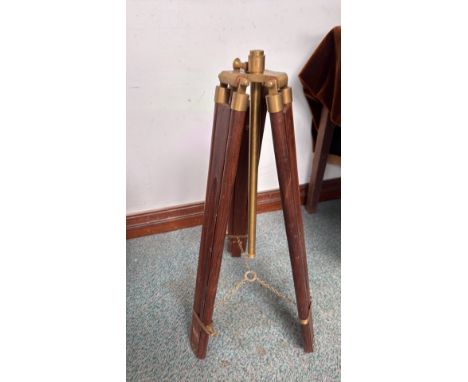 Antique brass and wood tripod stand features adjustable legs and brass fittings.