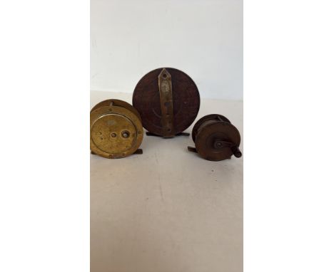 Vintage Ogden Smith fishing reel constructed from brass and wood, marked "Ogden Smith, Clapham Junction, Maker."