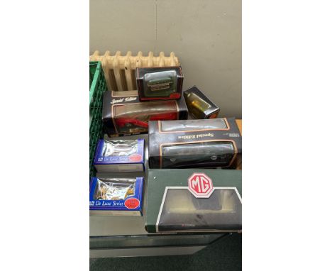 Collection of boxed diecast model cars and buses, including Corgi 1:18 scale 1962 MGB Roadster in Primrose, Special Edition v