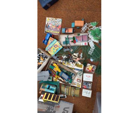 Large vintage Britains farm and zoo playset lot, including plastic animals, fencing, vehicles, and buildings from the 1970s.