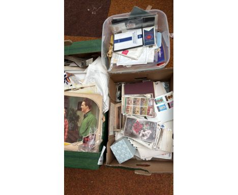 Extensive mixed lot of vintage ephemera, including postcards, stamps, documents, photographs, and collectible magazines. A tr