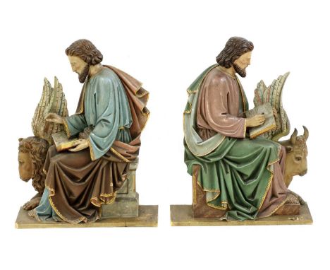 A pair of Continental polychrome carved wood ecclesiastical figures, late 19th century, of scribes seated on a winged lion an