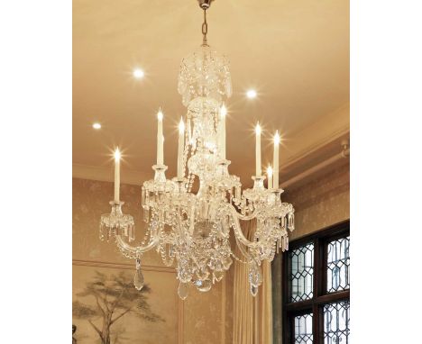 A George III-style cut-glass ten-light chandelier,20th century, with faceted chain swags and prism drops,100cm diameter130cm 