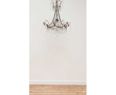 A Danish Louis XVI-style brass-framed six-light chandelier,c.1900, with a crown top, lustre swags and pendant drops, each bra