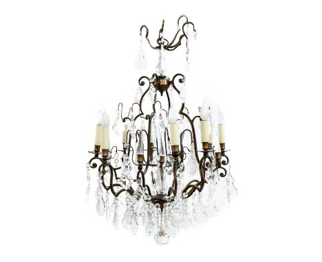 A cut-glass and gilt-metal chandelier,20th century, French, with eight scrolling branches, suspending shaped drops,70cm diame