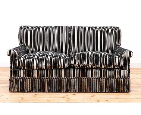 A modern two-seater sofa by Howard Chairs Ltd.,upholstered in Robert Allen black and cream striped fabric over Howard ticking