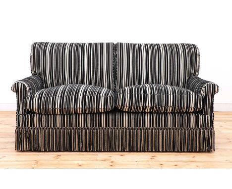 A modern two-seater sofa by Howard Chairs Ltd.,upholstered in Robert Allen black and cream striped fabric over Howard ticking