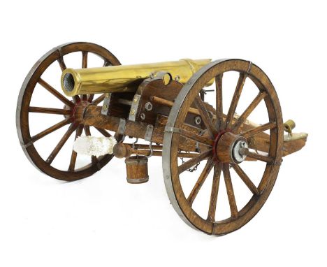 A model of an American Civil War field cannon,with brass barrel, and mounts,26cm wide45cm deep18.5cm highCondition report: Co