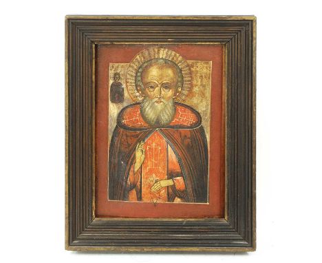 A Russian icon,18th-19th century, of a saint giving a blessing, oil on oak panel,29 x 21cm, in a reeded oak frameCondition re
