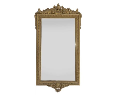 A large carved giltwood pier mirror, 19th century, the ornate foliate carved scrolling crest over a rectangular plate, the su