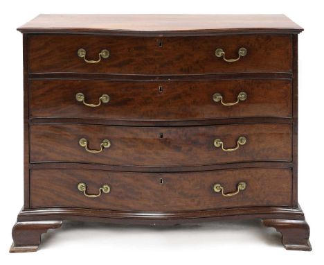 A George III mahogany serpentine front commode,c.1770, the upper drawer with a fitted sliding section above three further lon