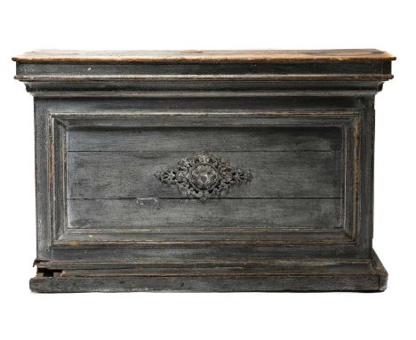 A French provincial painted shop counter,19th century, the scrubbed top above a panelled front, set with a central foliate ca