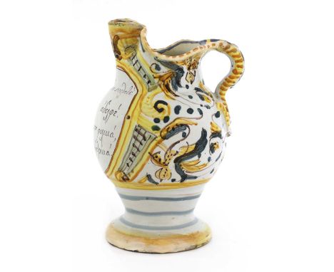 An Italian maiolica wine jug for the Greek market,early 19th century, Pesaro, of baluster form, set with a scrolling handle a